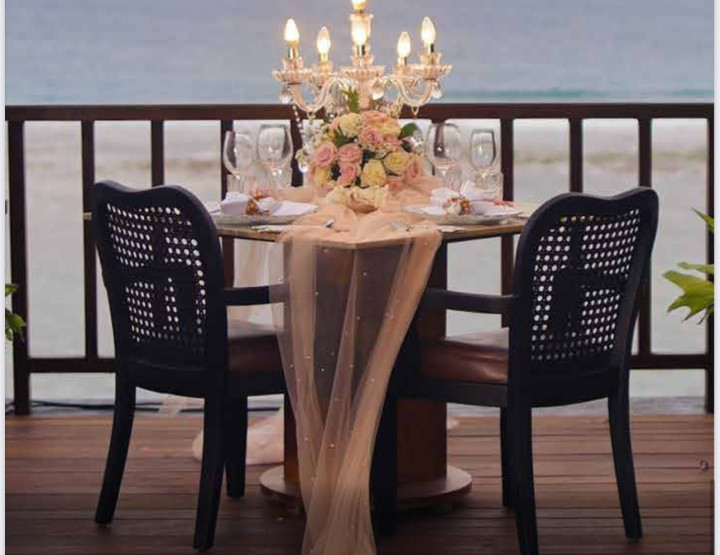 Romantic dinner in a gazebo on a cliff overlooking the ocean