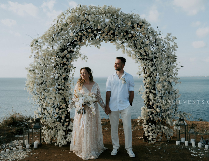 Stylish White Bougainvillea Wedding on a cliff above the ocean